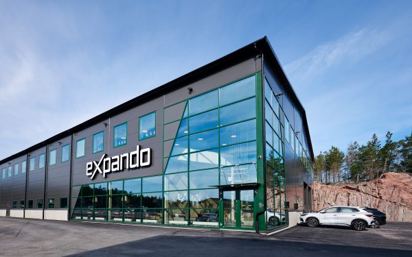 office building with green details and blus skies